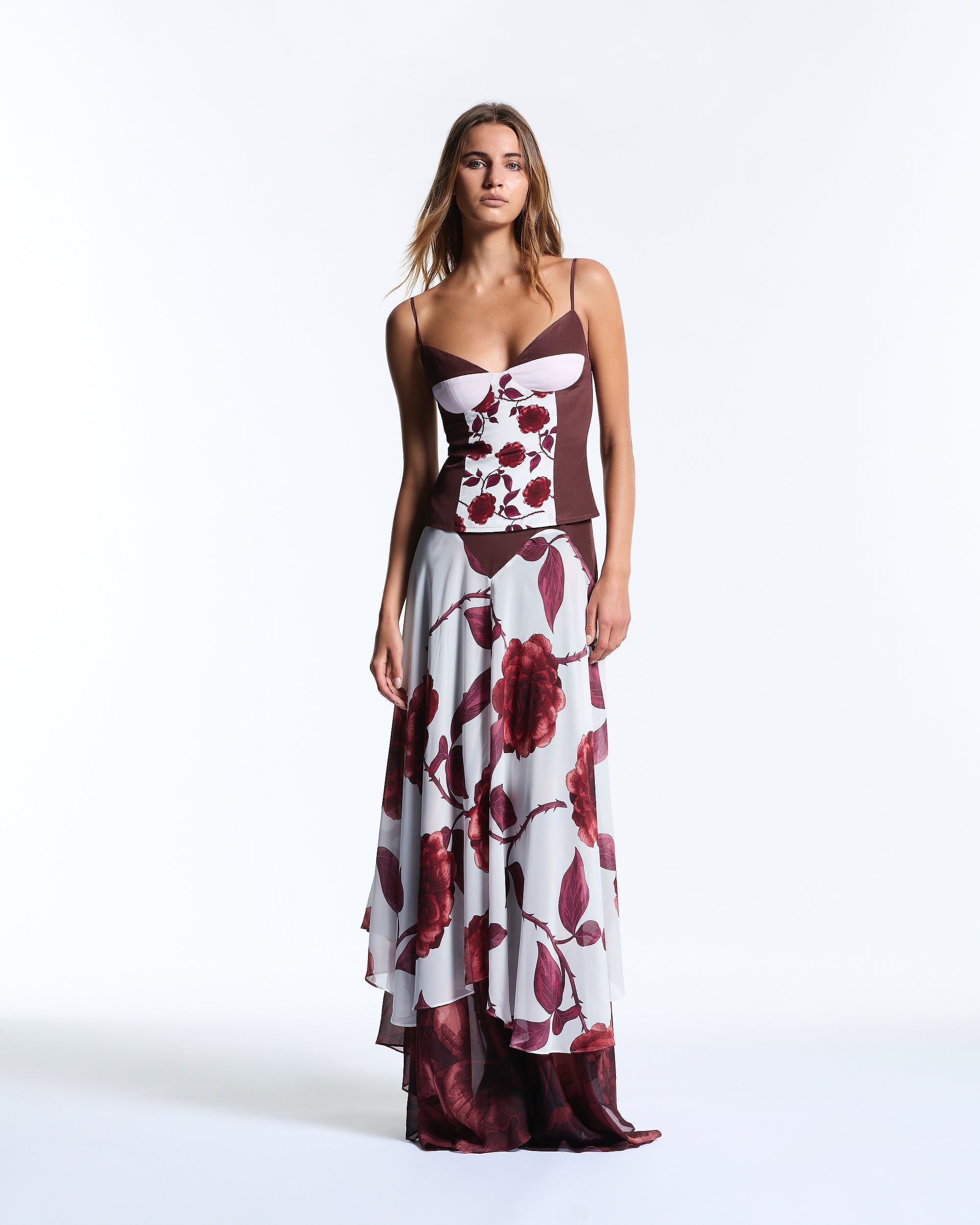 Woman wearing a floral dress with a white background