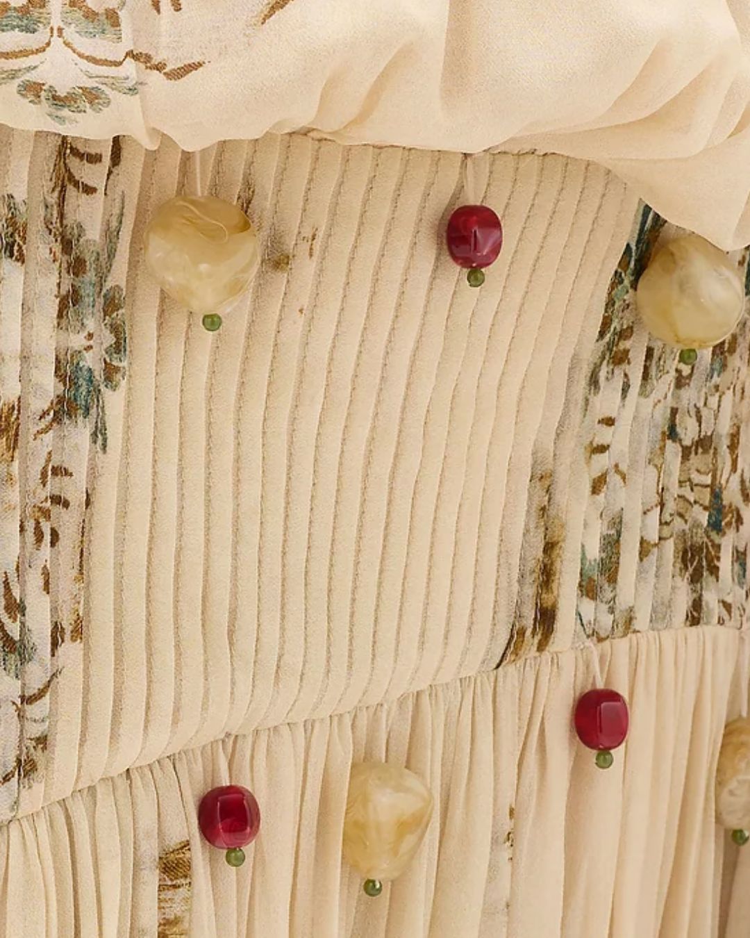 Pleats and appliqué beading